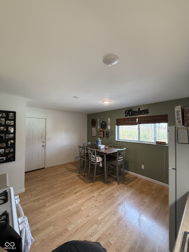 dining room with light wood-type flooring