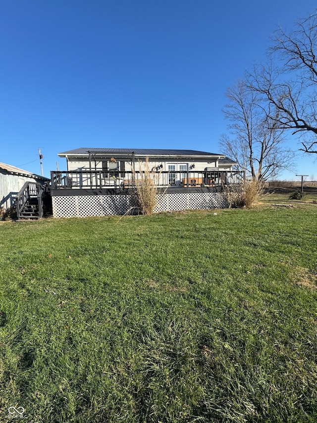 exterior space with a lawn and a deck