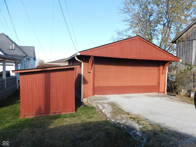 garage with a yard