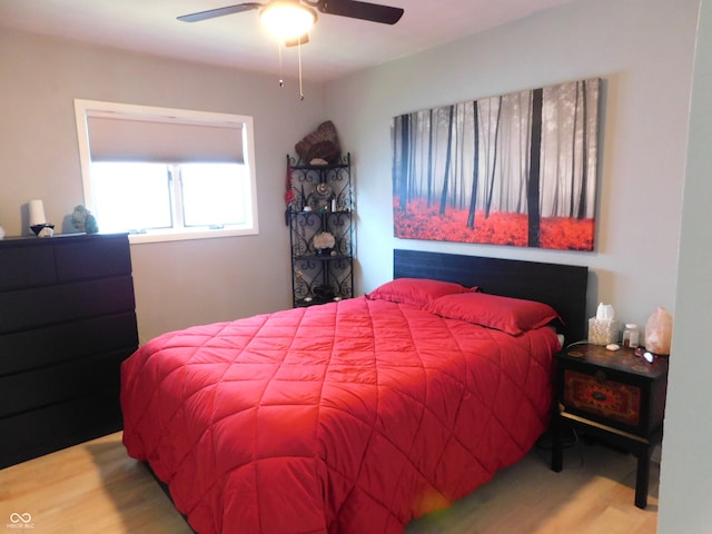 bedroom featuring ceiling fan and light hardwood / wood-style flooring