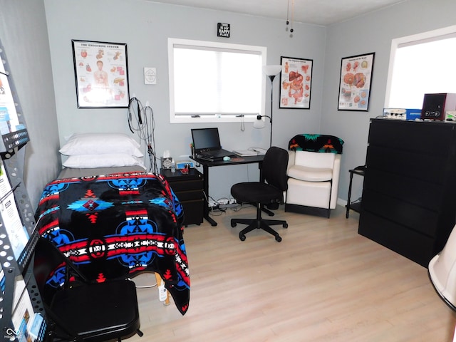 bedroom with light hardwood / wood-style floors