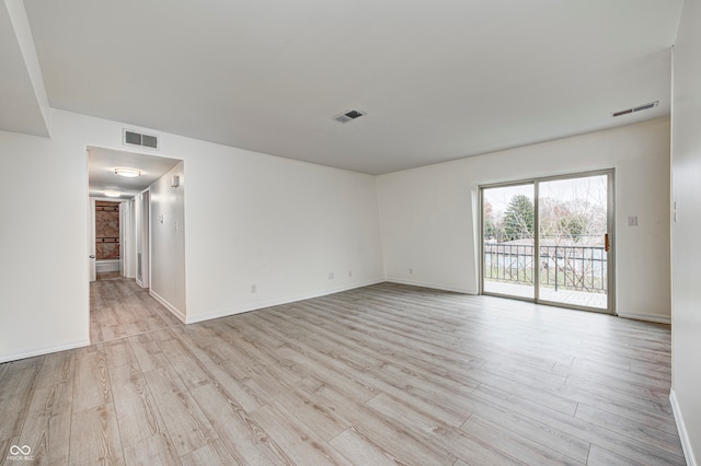 unfurnished room featuring light hardwood / wood-style flooring