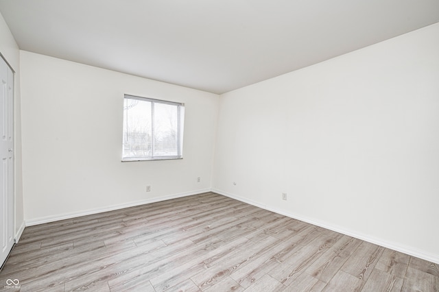 unfurnished room with light hardwood / wood-style floors