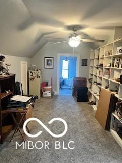 carpeted office featuring ceiling fan and lofted ceiling