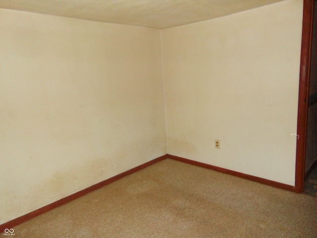 empty room with carpet flooring