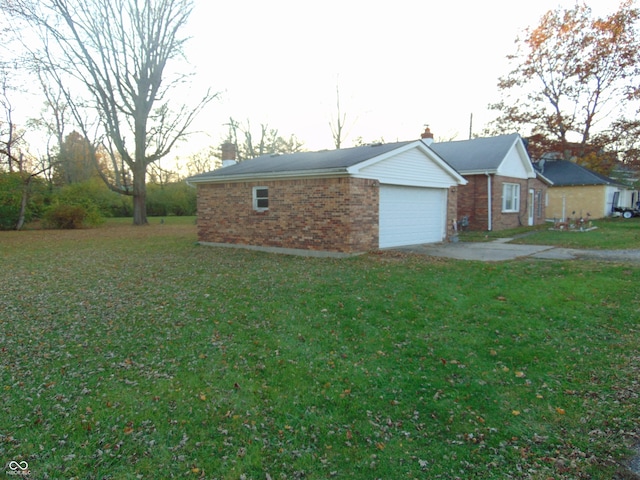 view of front of property with a front yard and a garage