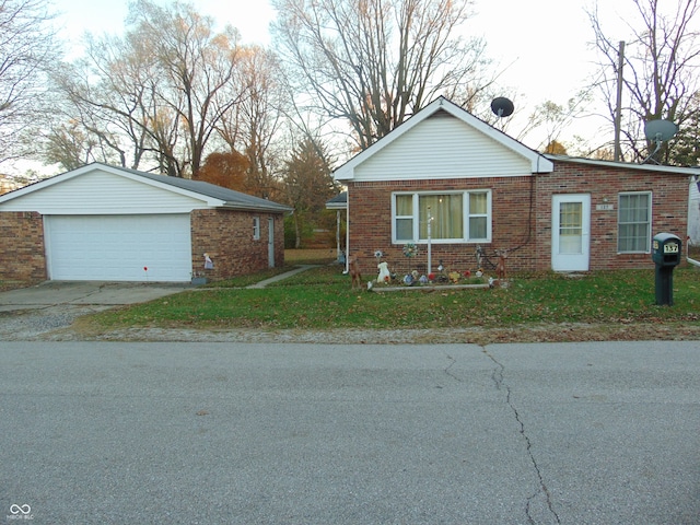 view of front of house with a garage and a front lawn