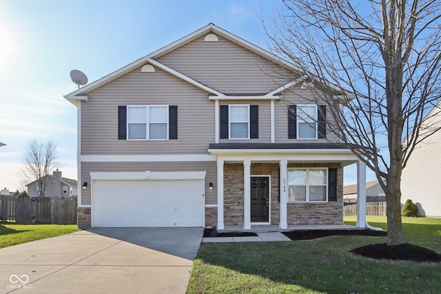 front of property with a front lawn and a garage