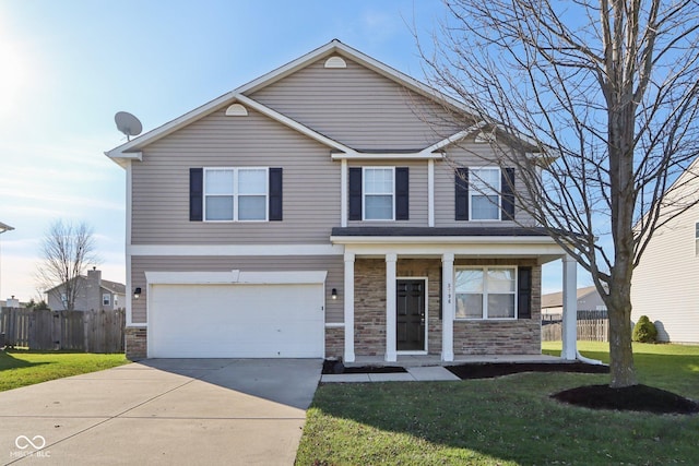 view of property featuring a garage and a front lawn