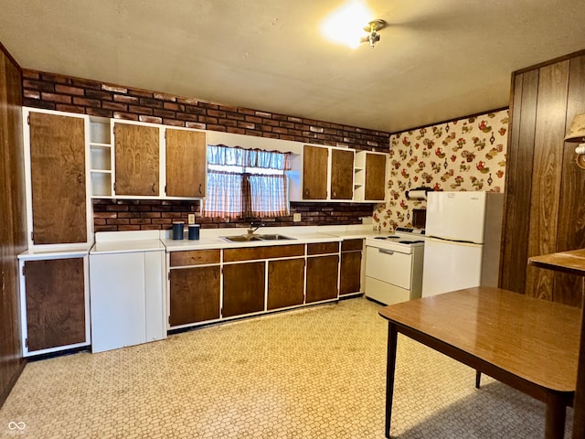 kitchen with sink and white appliances