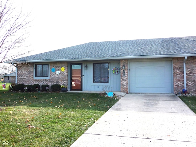 single story home featuring a garage and a front lawn