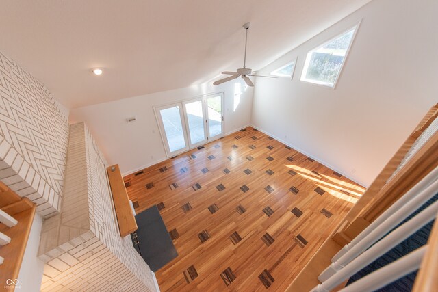 living room featuring high vaulted ceiling and ceiling fan