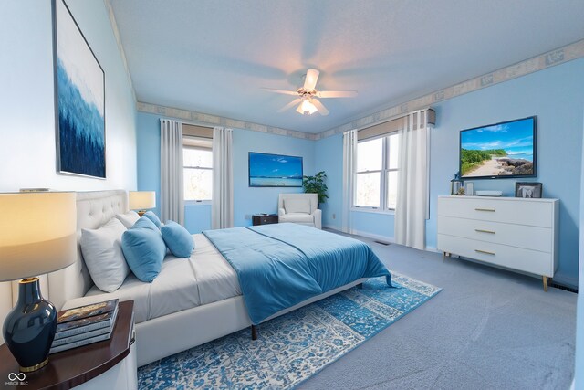 carpeted bedroom featuring ceiling fan