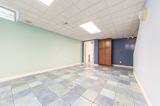 basement featuring a drop ceiling