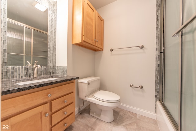 full bathroom featuring tile patterned floors, vanity, toilet, and enclosed tub / shower combo