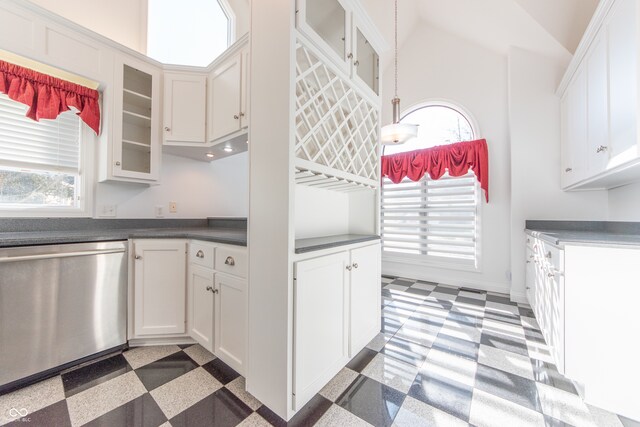 kitchen featuring white cabinetry, hanging light fixtures, and stainless steel dishwasher