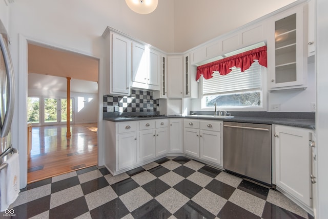 kitchen featuring sink, white cabinets, and stainless steel appliances