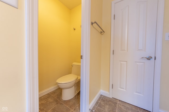 bathroom featuring tile patterned flooring and toilet