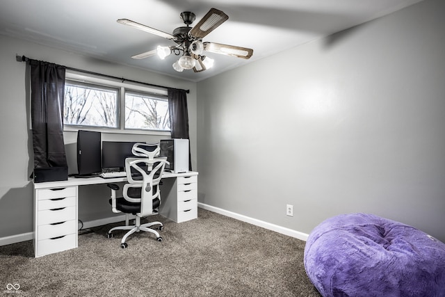 office space featuring ceiling fan and dark colored carpet