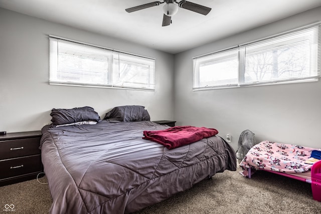 bedroom featuring ceiling fan and carpet