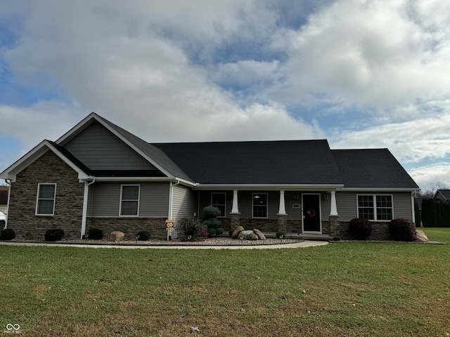 craftsman-style house with a front lawn and covered porch