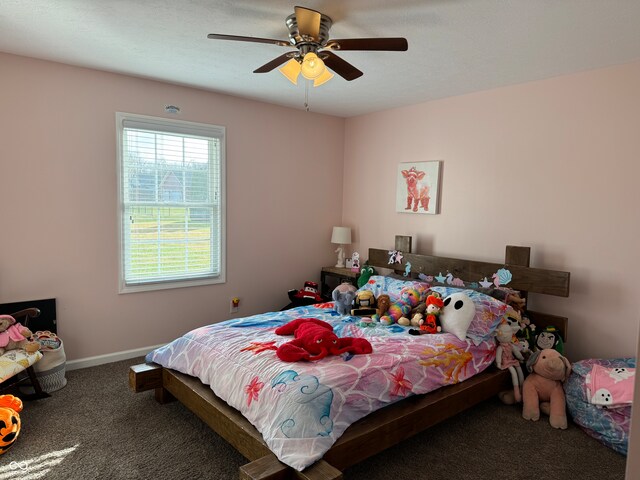 bedroom featuring ceiling fan and carpet floors