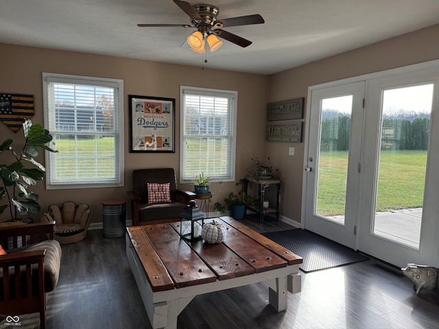 interior space with ceiling fan and dark hardwood / wood-style floors