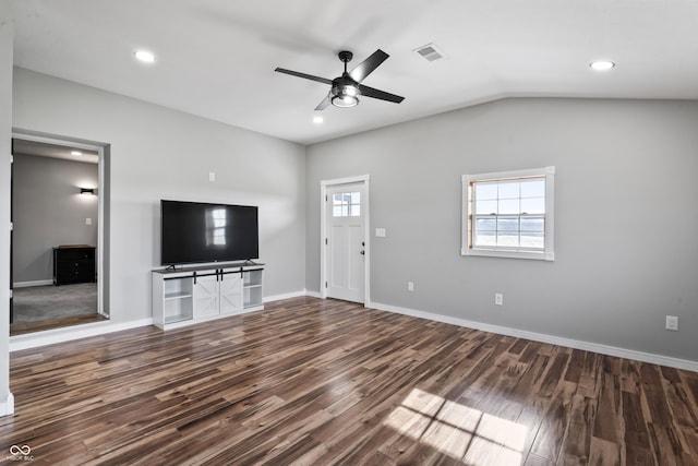 unfurnished living room featuring ceiling fan, dark wood-type flooring, and vaulted ceiling