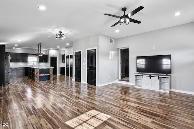 9462 N Rushville Rd, Knightstown, IN 46148 - unfurnished living room with dark wood-style flooring, recessed lighting, a ceiling fan, baseboards, and lofted ceiling