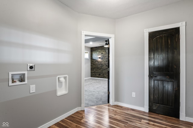 foyer entrance with ceiling fan and dark hardwood / wood-style flooring