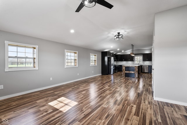 9462 N Rushville Rd, Knightstown, IN 46148 - unfurnished living room featuring dark wood-style flooring, ceiling fan, baseboards, and recessed lighting