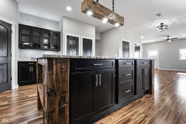 9462 N Rushville Rd, Knightstown, IN 46148 - kitchen with wood finished floors, dark cabinets, ceiling fan, baseboards, and recessed lighting