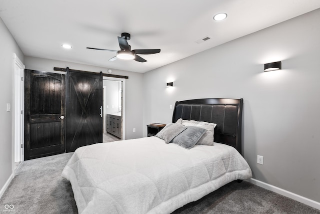 9462 N Rushville Rd, Knightstown, IN 46148 - bedroom with carpet, baseboards, recessed lighting, a barn door, and a ceiling fan