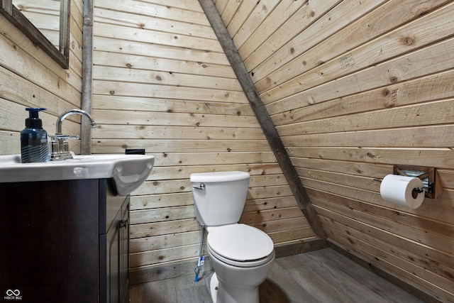 9462 N Rushville Rd, Knightstown, IN 46148 - bathroom featuring wood walls, toilet, vanity, and wood finished floors