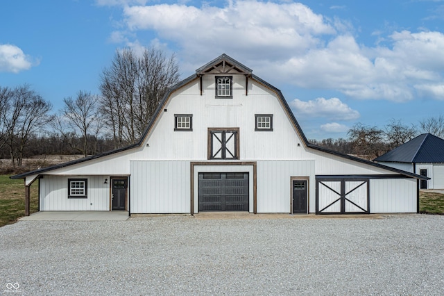 9462 N Rushville Rd, Knightstown, IN 46148 - garage with a detached garage and gravel driveway