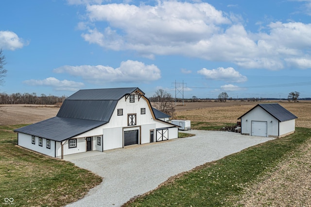 9462 N Rushville Rd, Knightstown, IN 46148 - view of front of home with a detached garage, a barn, an outbuilding, a gambrel roof, and gravel driveway