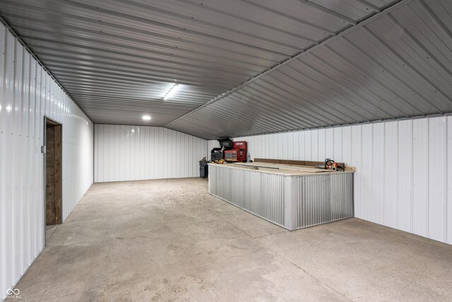 9462 N Rushville Rd, Knightstown, IN 46148 - bonus room with vaulted ceiling and concrete floors