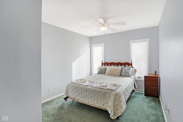 bedroom with dark carpet and ceiling fan