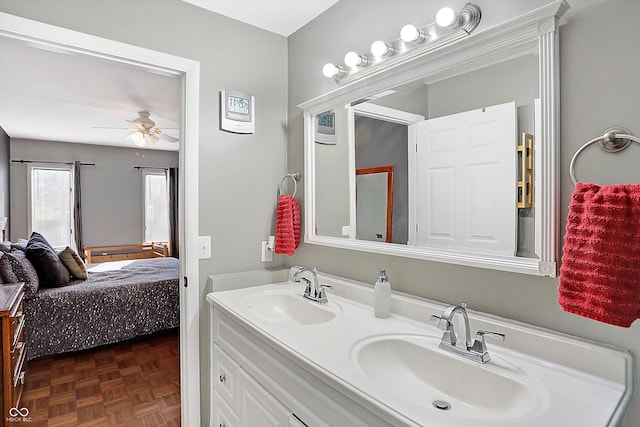 bathroom with ceiling fan, parquet floors, and vanity