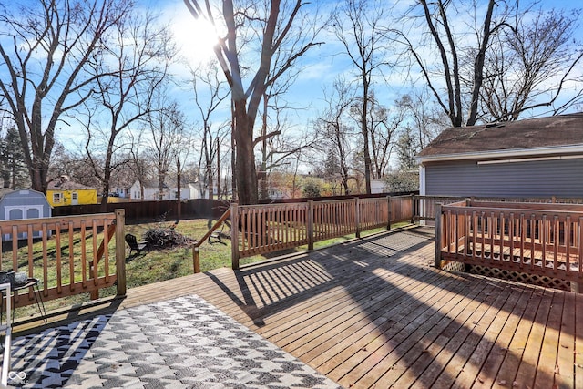 wooden terrace featuring a storage shed