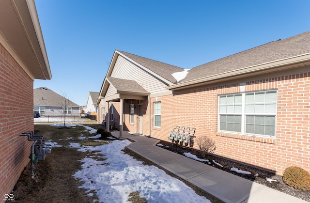 view of snow covered property