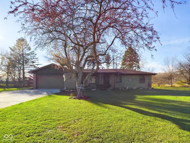 ranch-style home with a front lawn and a garage