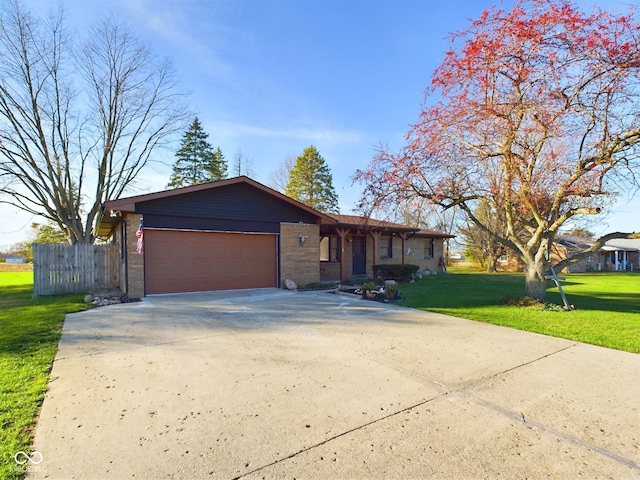 ranch-style home featuring a front lawn and a garage