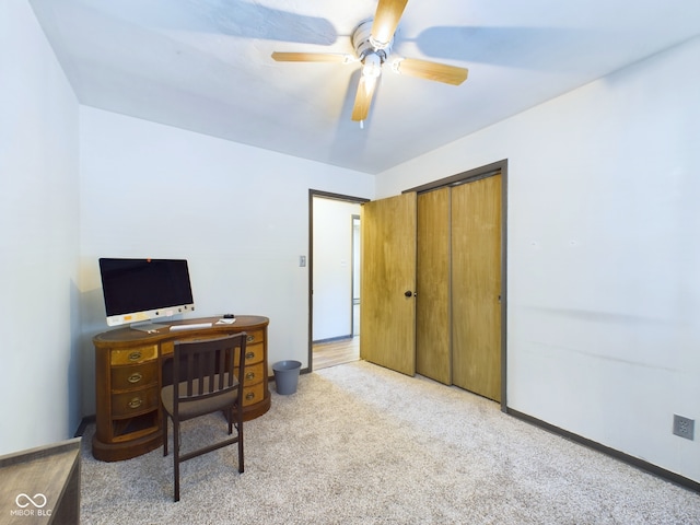 home office featuring ceiling fan and light colored carpet