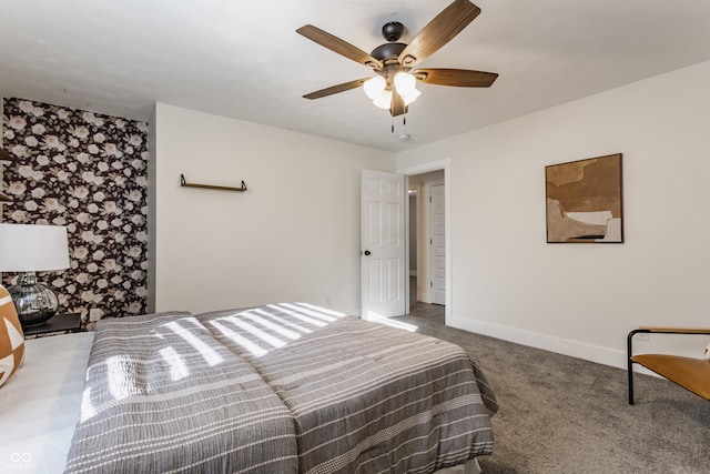 bedroom featuring ceiling fan and carpet