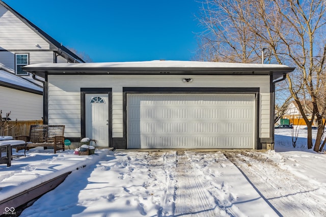 view of snow covered garage