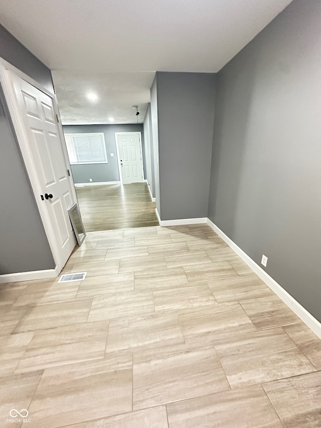 corridor featuring light wood-type flooring