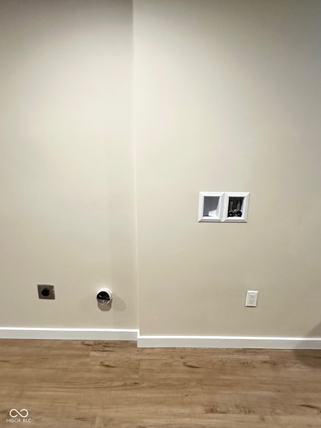 laundry room with hardwood / wood-style floors, electric dryer hookup, and hookup for a washing machine