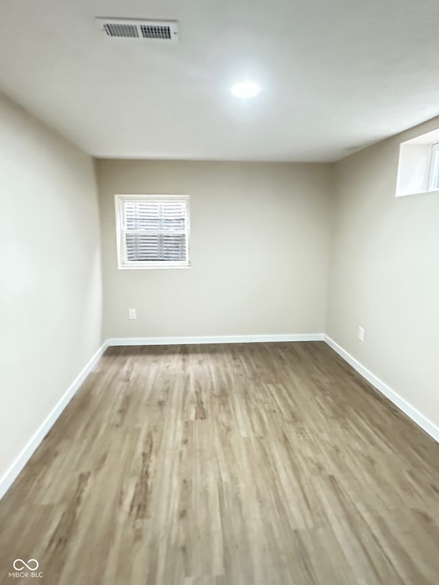 spare room with hardwood / wood-style floors