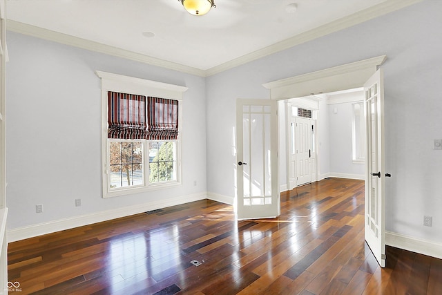 foyer entrance with french doors, dark hardwood / wood-style floors, and ornamental molding